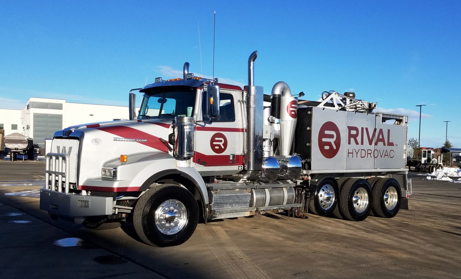 The front section of a black hydrovac truck