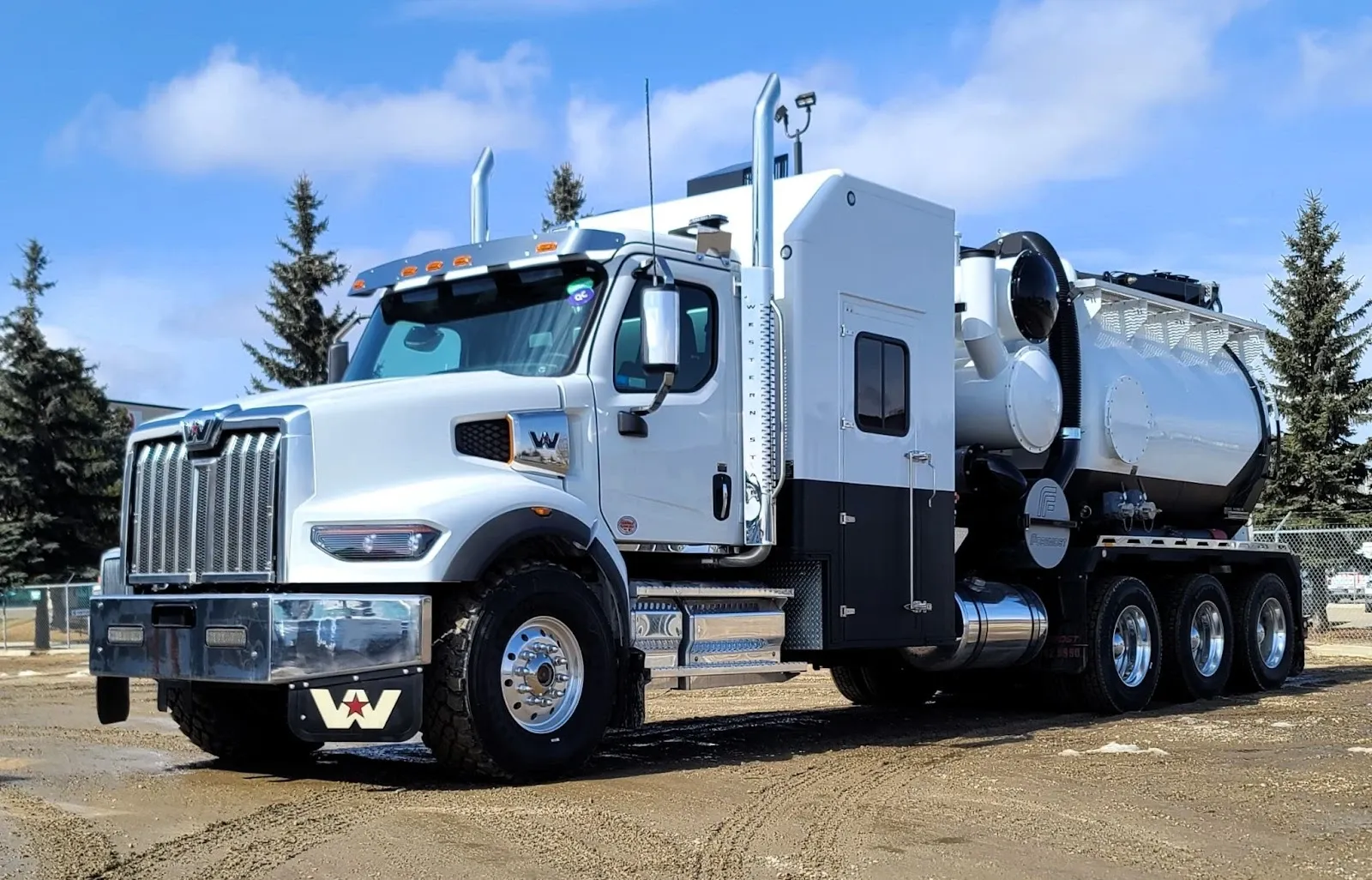 A white hydrovac truck