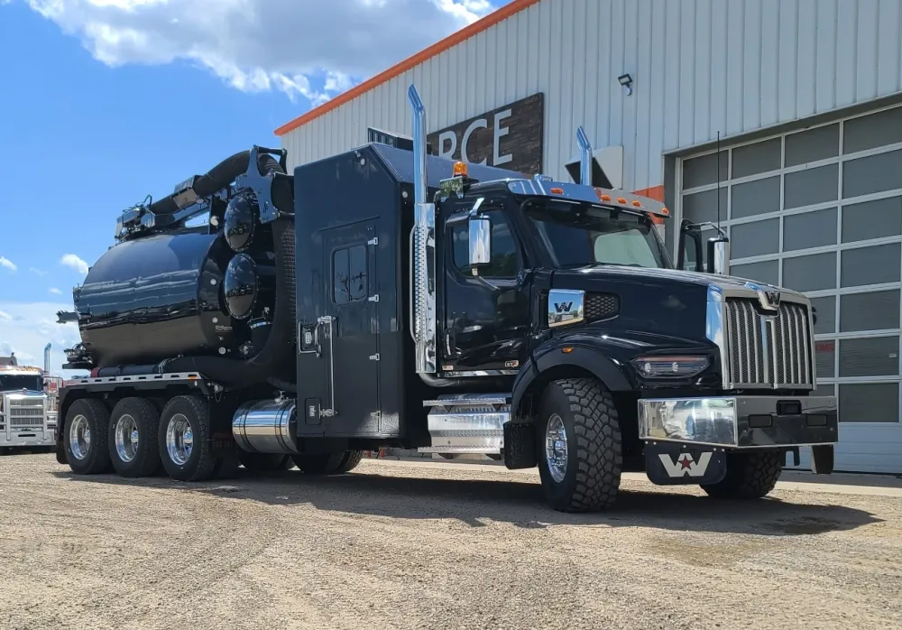 A black hydrovac truck