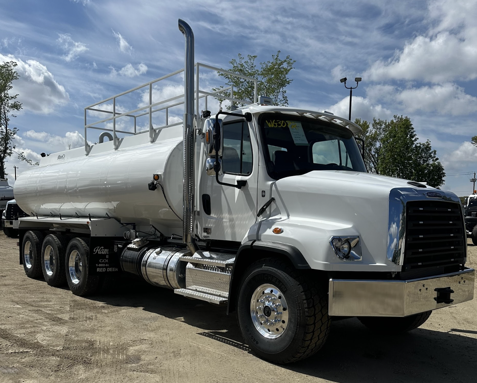 A water truck sits outside